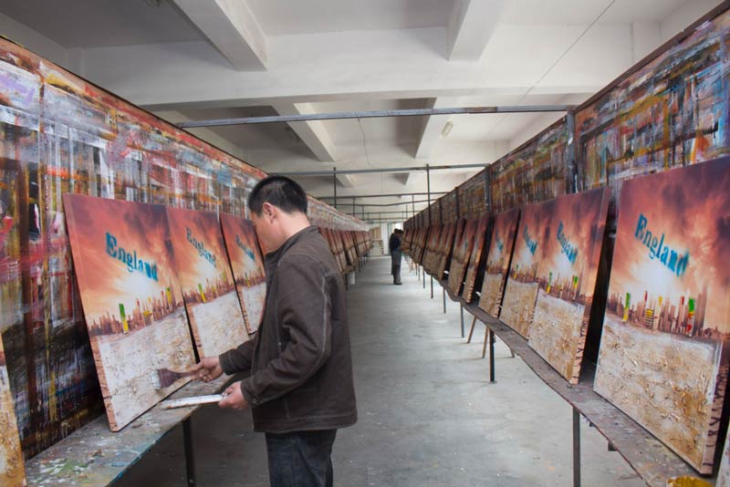 A painter does the same set of strokes down an aisle of identical paintings